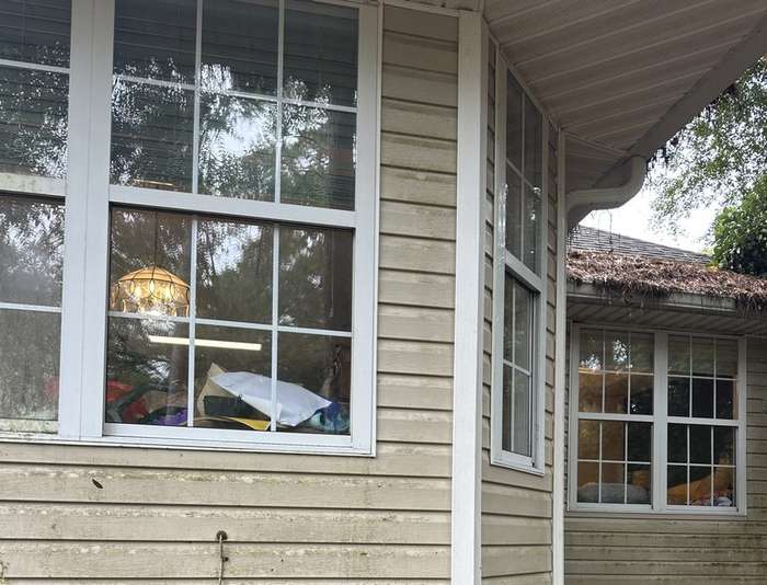 Same house window after the 5-in-1 clean: clear glass, clean frame